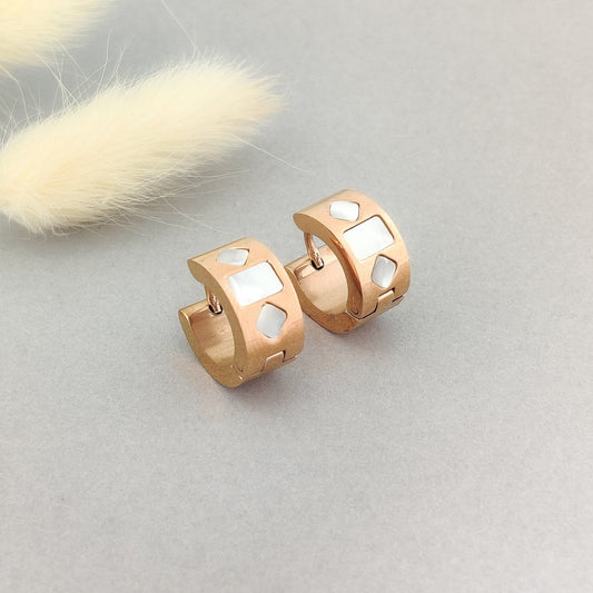 "Rose gold enamel huggie hoop earrings for women with white geometric inlay."