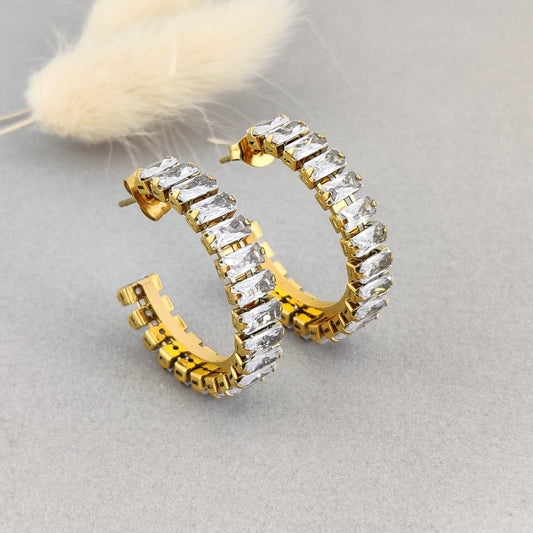 “Dainty infinity design gold huggie hoop earrings for women with CZ diamonds – minimalist jewellery.”