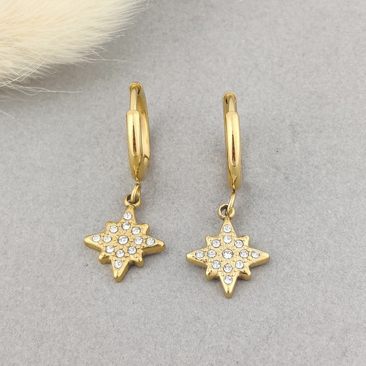 “Gold-plated star dangle earrings with sparkling crystal stones for women.”