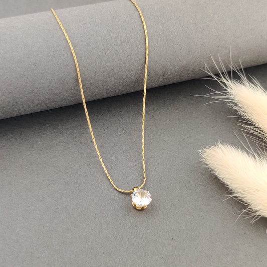 "Minimal gold necklace with a single round crystal pendant, elegant everyday jewelry for women, dainty gold chain necklace for gifting and layering."