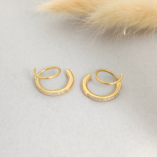 “Elegant gold double hoop earrings with cubic zirconia detailing, modern lightweight jewellery.”