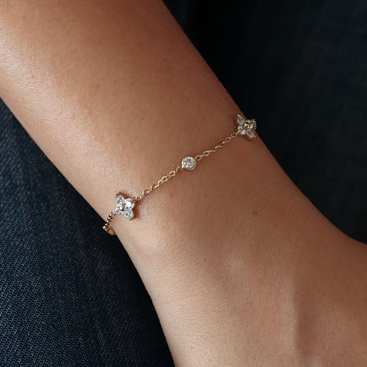 “Gold plated crystal flower bracelet with cubic zirconia charms on delicate adjustable chain for women, dainty minimalist jewellery for gifting and everyday wear.”