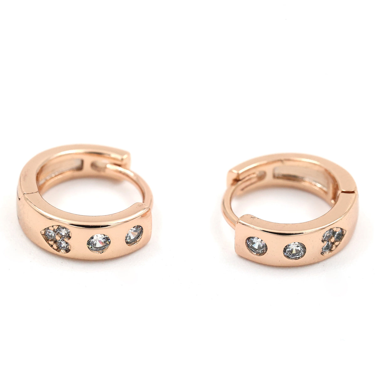 "Rose gold-plated huggie hoop earrings with triple cubic zirconia stones."